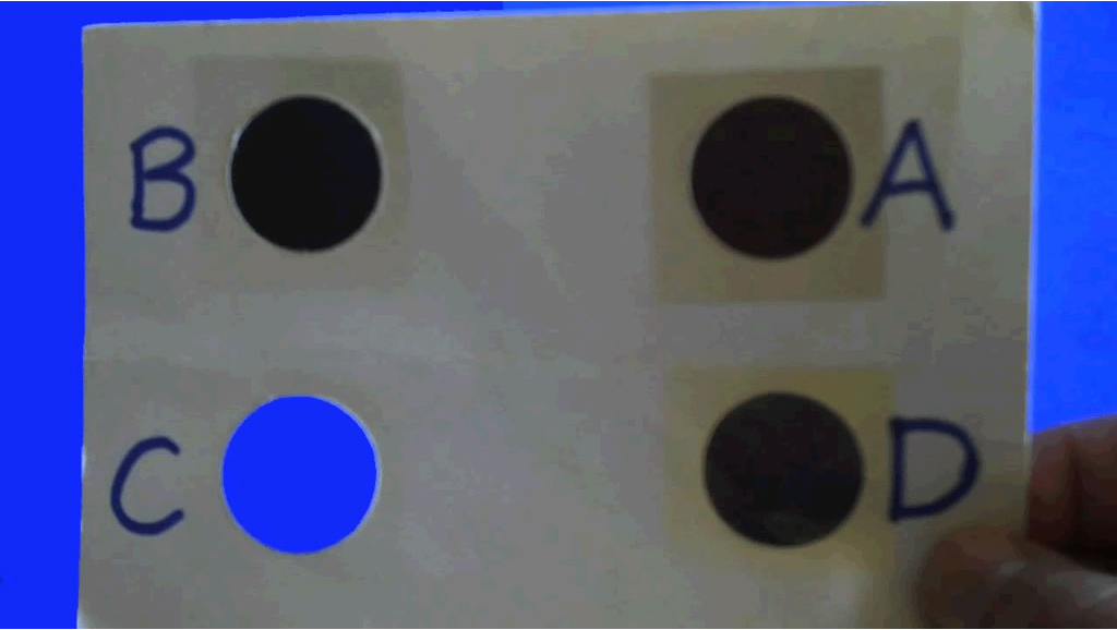 Image of color analyzer against a blue background, positioned 45° from the horizon.