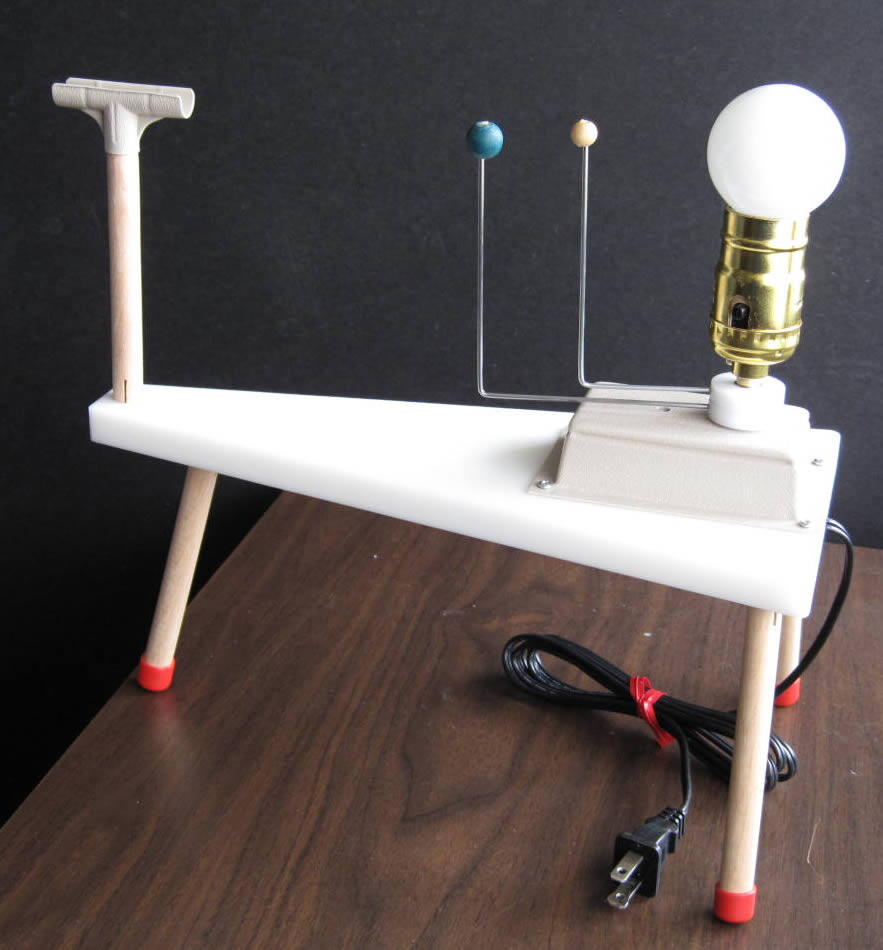 Commercially available 2-planet orrery with light sensor stand.